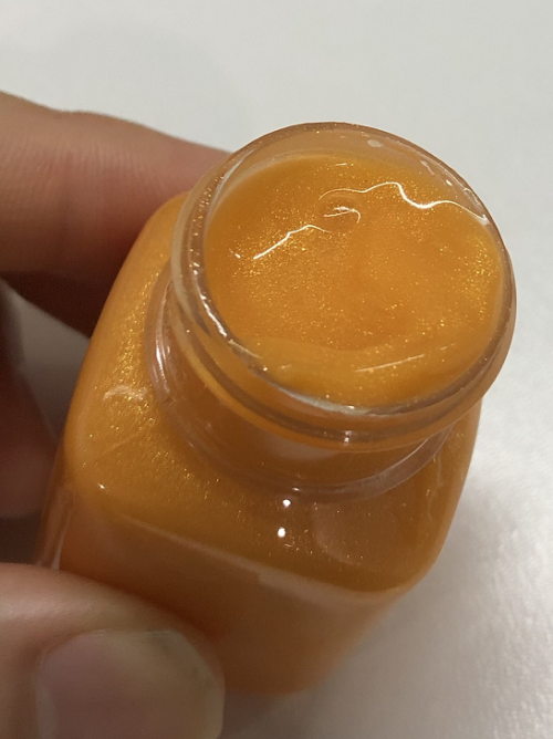 化妆品-橙黄色清香味防晒乳液+金粉