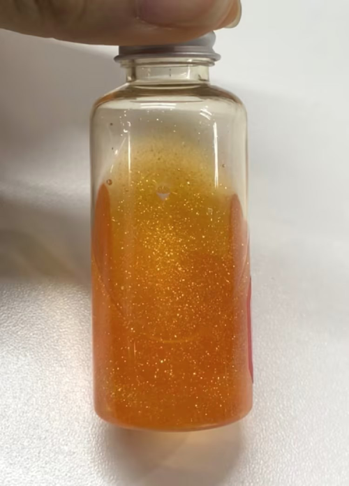 化妆品-橙色清香味精华液+金粉