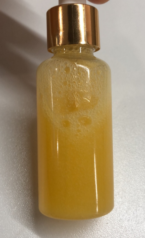 化妆品-橙黄色清香味去角质精华液
