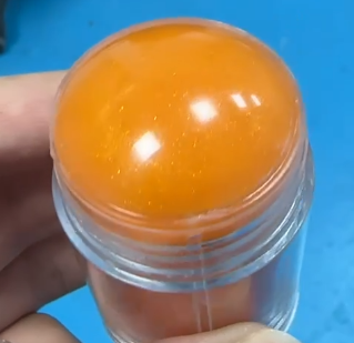 化妆品-橘色半透精华棒+金粉